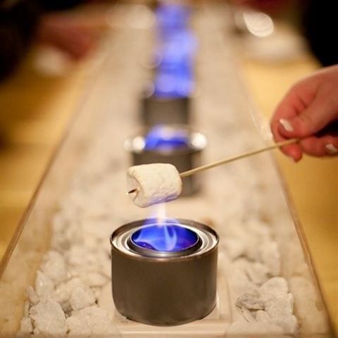 s'mores bar will keep guests warm and cozy and they'll have fun