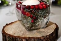 38 berries and fir with a floating candle