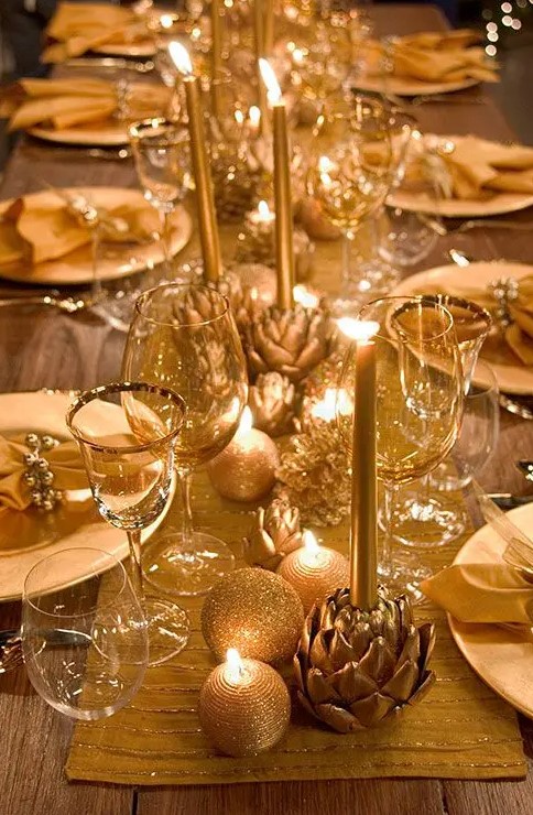 Christmas ornaments placed on the table runner and ornament-shaped candles are amazing to decorate your tables