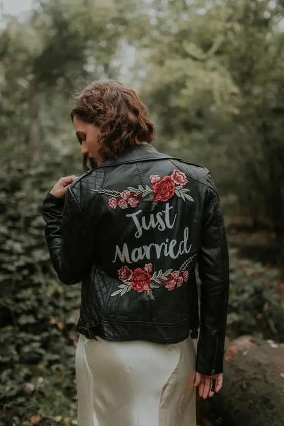 a beautiful black painted floral leather jacket with calligraphy is always a good idea for a wedding, it will bring a touch of drama