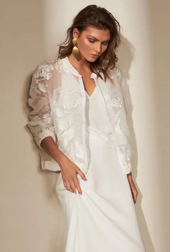 a beautiful oversized sheer bridal jacket with lace applique and embroidery is a stunning cover up for a fall or winter bridal shower