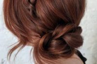 a braided halo plus a braided low bun and some locks down is a cool idea of a wedding updo, for any bride