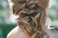 a braided side-swept medium hairstyle with curly tips is a cool and chic idea with a slight romantic touch