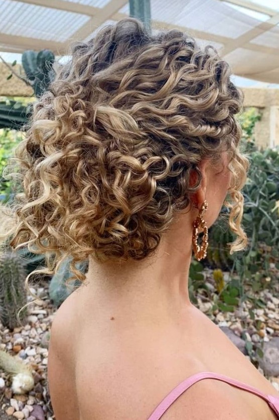 a catchy curly wedding updo will fit medium and long hair, leave some curls down to frame the face