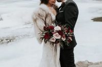 a chic and romantic lace mermaid wedding dress and a neutral faux fur cover up are amazing for a fall or winter wedding
