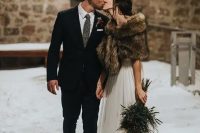 a chic bridal look with an A-line wedding dress and a brown faux fur cover up is a gorgeous idea for fall or winter