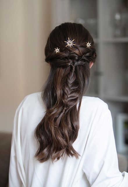 a chic half updo with a twisted touch and a loose braid, waves down and celestial hair pins is amazing