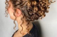 a curly updo with a curly top and some curls down to make it look more effortless is a chic idea