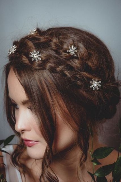 a double braided halo wedding updo with face-framing hair and celestial hair pins is amazing