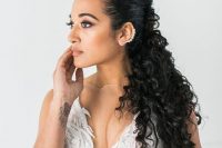 a dreamy and relaxed curly half updo is a cool way to style your hair and it will fit many outfits