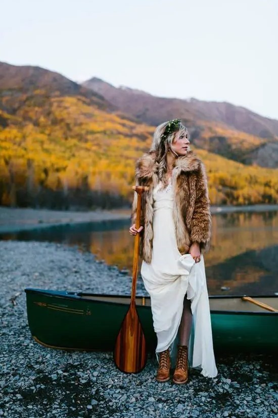 a fur coat and comfy brown boots make the bridal look complete and she feels comfortable outside