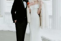 a glam bridal look with a catchy off the shoulder mermaid wedding dress, a pearl necklace, a white faux fur jacket for a winter wedding