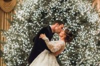 a large Christmas tree fully covered with lights is a perfect Christmas wedding backdrop, what can be more natural than this