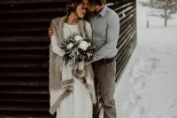 a long faux fur cover up with no sleeves is a lovely idea to feel warm and show off your wedding dress