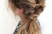 a messy side braid into a ponytail, with a messt braided top, some waves down is a lovely idea for a boho bride