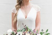 a messy twisted loose braid with some locks down on one side and waves is a cool idea for any bridal look that it’s not too formal