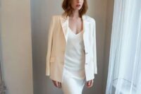a modern and casual wedding dress with a V-neckline and a mermaid skirt, a matching blazer for a modern look