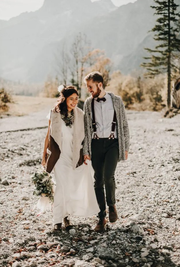 a plain boho wedding dress plus a brown shearling coat with faux fur in neutrals to complete a boho bridal look