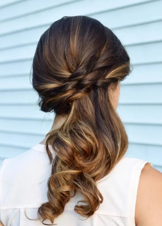 A side swept half updo with waves is a chic and cool idea with a boho feel, it looks nice and pretty