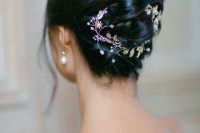 a twisted updo with a hair vine and some face-framing locks is a cool idea for a bride with medium-length hair