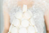 a white macaron tower is a glam and chic substitute to a usual wedding cake, it’s a refined and chic alternative