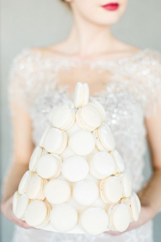 a white macaron tower is a glam and chic substitute to a usual wedding cake, it's a refined and chic alternative