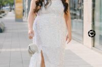 a white sequin midi dress with straps, a square neckline, clear shoes and an embellished bag for a holiday bridal shower