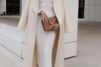 an elegant outfit with a midi strapless dress, a cover up, brown shoes with chain and a brown bag