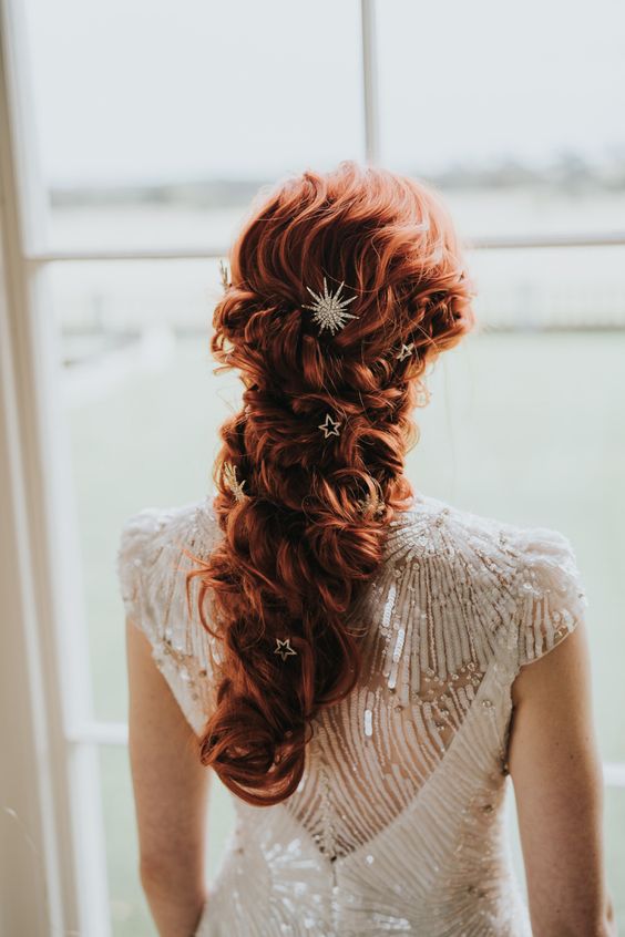 gorgeous long copper hair in a twisted low ponytail, with a bump on top and celestial hair pins is amazing for any season