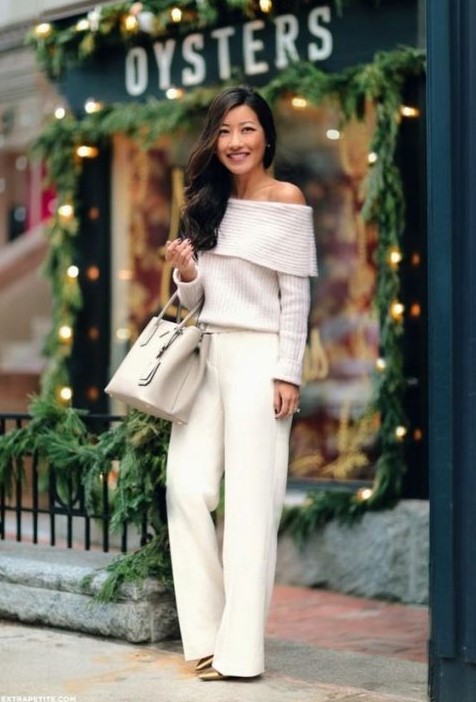 white palazzo pants, an off the shoulder sweater and metallic shoes plus a neutral bag
