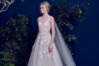 02 An ivory gown with colored floral appliques and a sweetheart neckline
