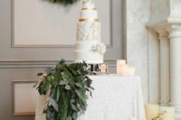 02 hang a winter wedding wreath as a backdrop for your dessert table and add a echoing garland to the table itself