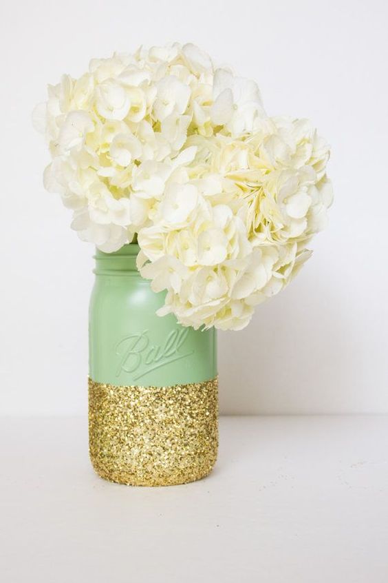 mint and giltter mason jar with white hydrangeas for a wedding centerpiece