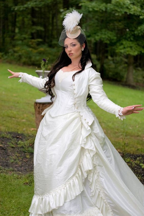 ivory Victorian steampunk wedding gown and a hat with a veil