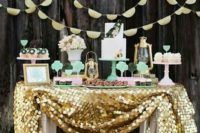 04 lovely mint and gold dessert table, a giant sequin tablecloth and mint stands and displays
