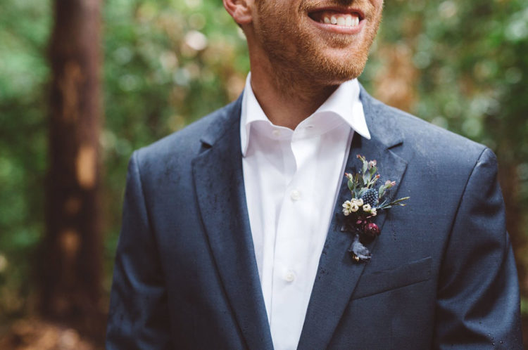 The groom looked cool and relaxed in a blue suit with no tie