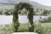 05 lush evergreen ceremony arch for a winter wedding