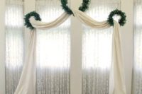 05 three wreaths and a curtain can become a wedding arch