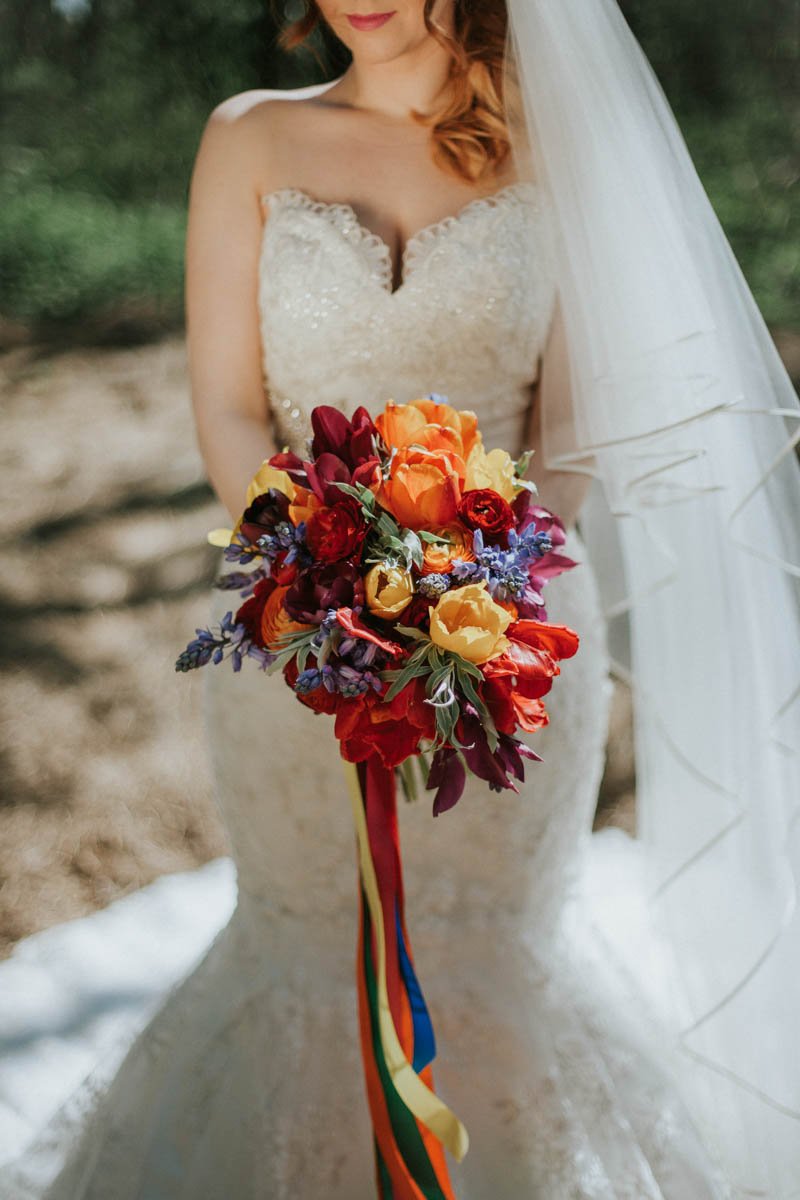 The bridal bouquet was a super bold one, in red, peach, yellow and lavender colors
