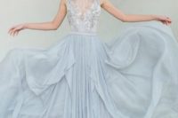 06 dusty blue wedding dress with a tulle skirt and a lace embellished top with an illusion neckline