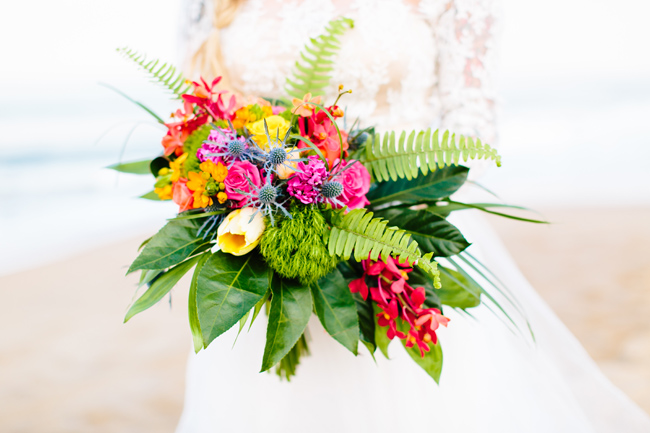 The wedding bouquet echoed with the centerpiece, it was done in bold flowers