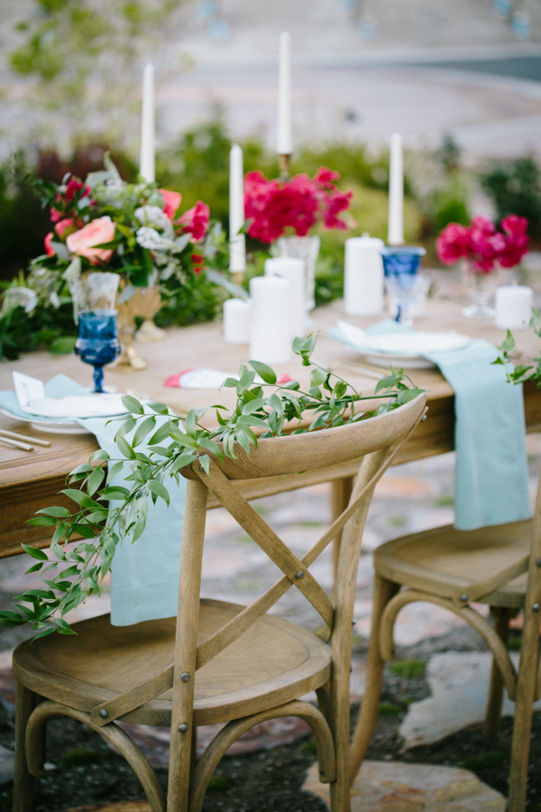 The wedding tablescape was a fine art one, with colorful dishes, glasses and greenery