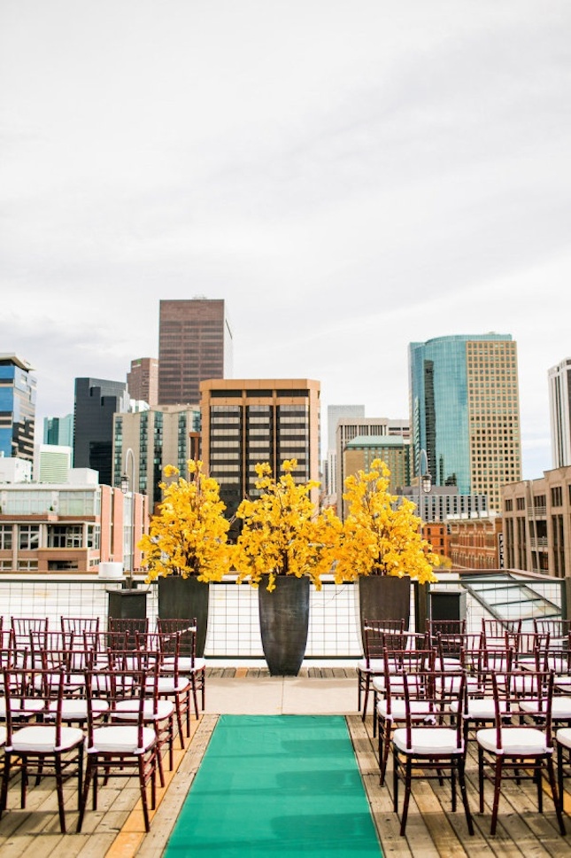 fall city landscape embraced   yellow trees at the end of the aisle differentiate the space naturally