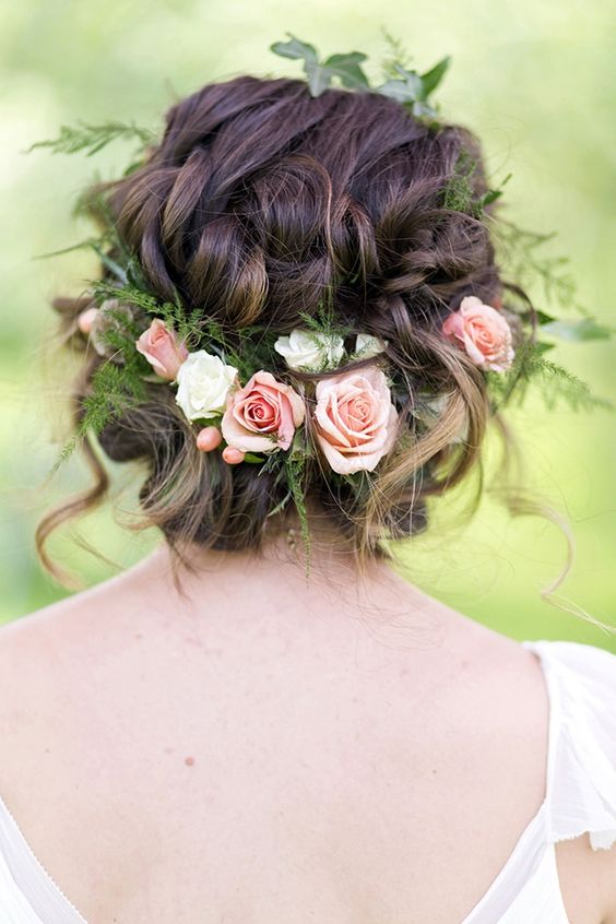 messy braided updo with fresh roses