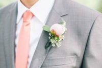 10 grey groom’s suit with a crispy white shirt and a peach tie