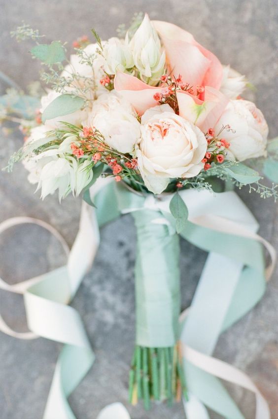 peach and blush bouquet with a mint wrap
