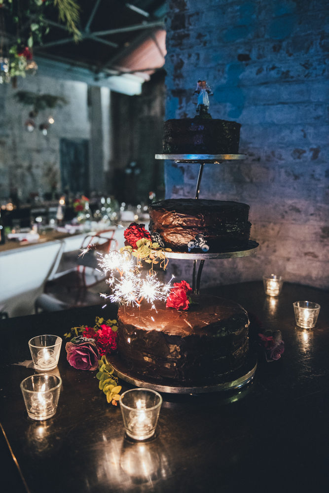There were three chocolate wedding cakes topped with sparklers and flowers