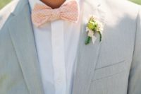 11 dove grey groom’s suit with a white shirt and a polka dot bow tie