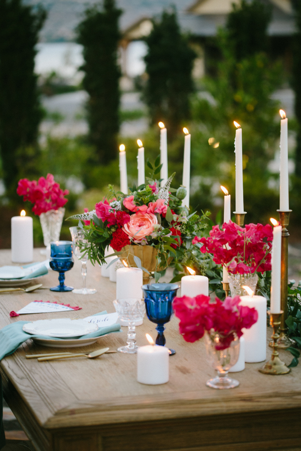 Candles and bold florals created a mood and made the table settign vibrant