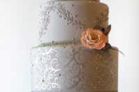 14 grey and silver wedding cake with a peach flower